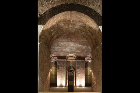 The raw brick vaults of the undercroft are powerfully expressed by uplighters